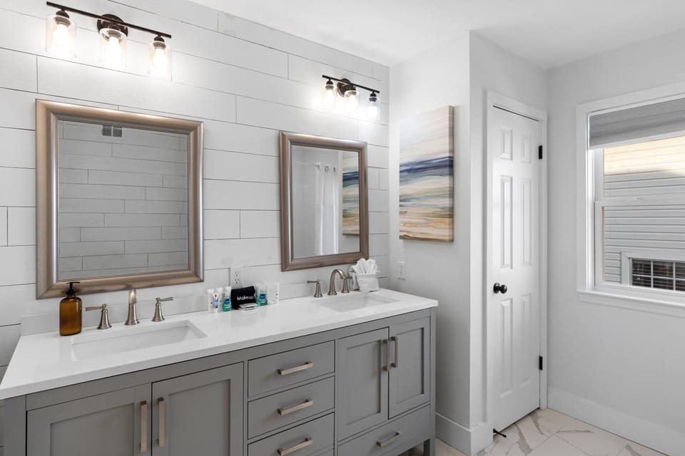 Remodeled Master Bathroom has dual vanities and walk in shower