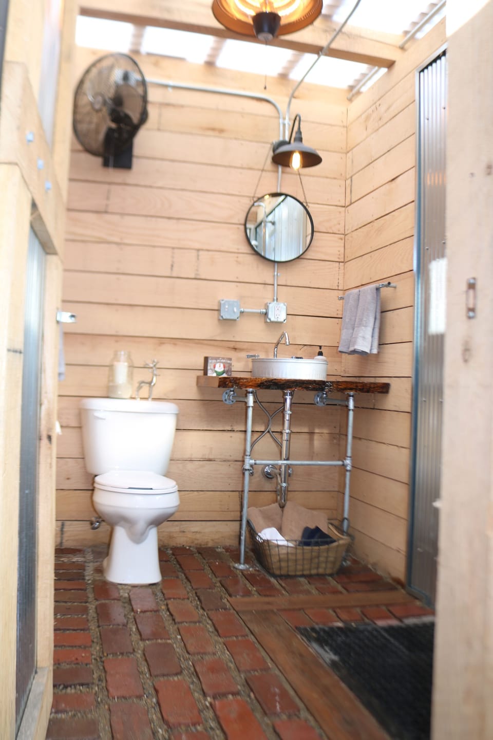 Full bathroom complete with farm sink & rain-head shower. 