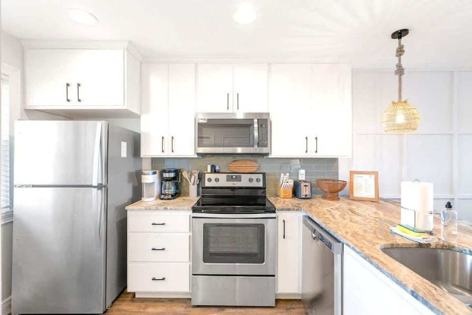 Fully stocked kitchen for cooking meals.