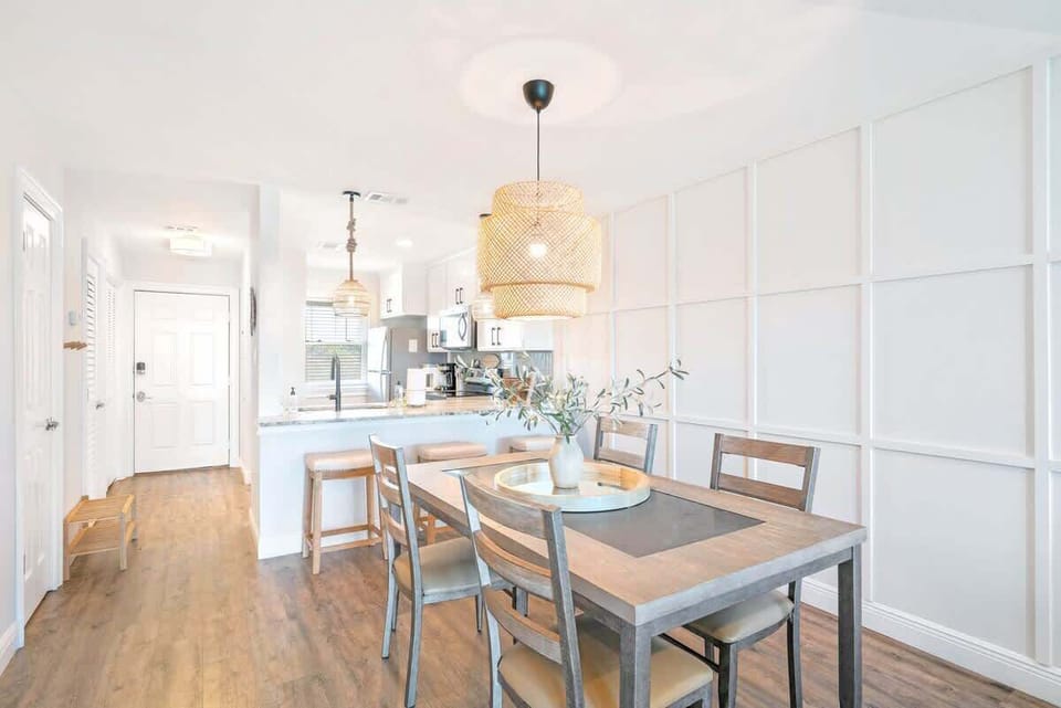 Dining room features 4 seats at the table.