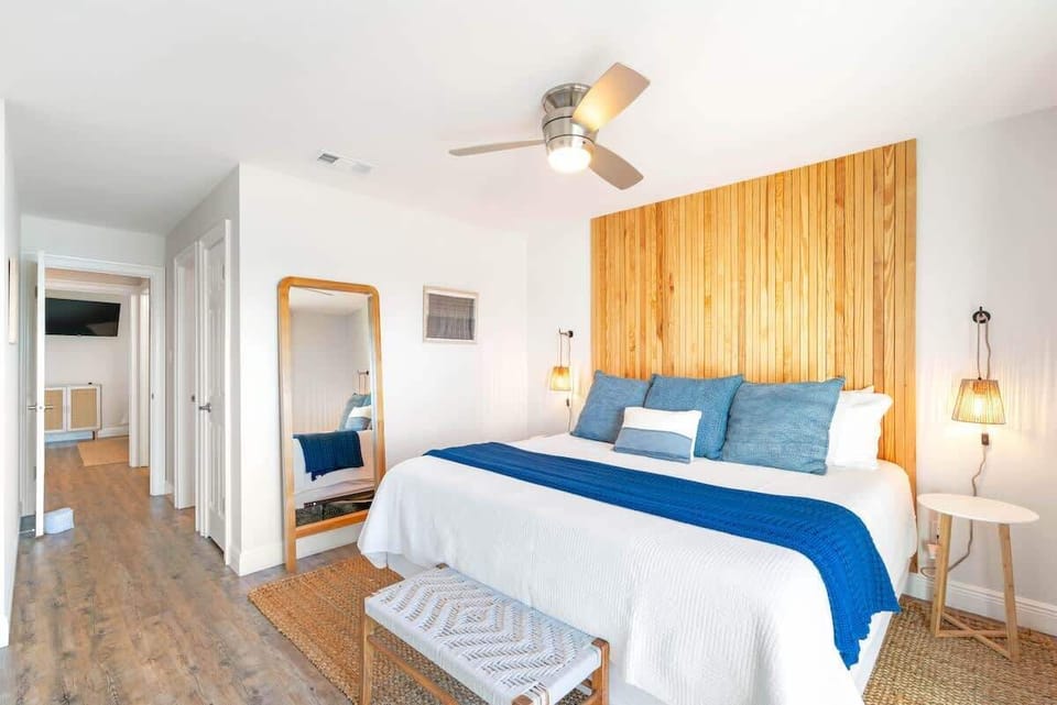 Spacious primary bedroom with king bed and ensuite.