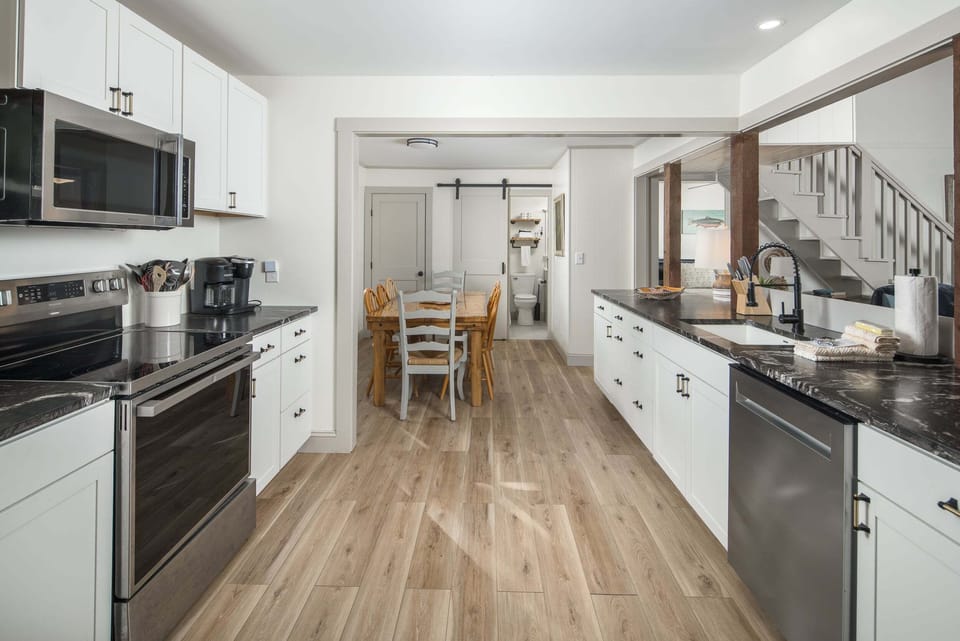 Fully equipped kitchen with granite countertops and stainless steel appliances