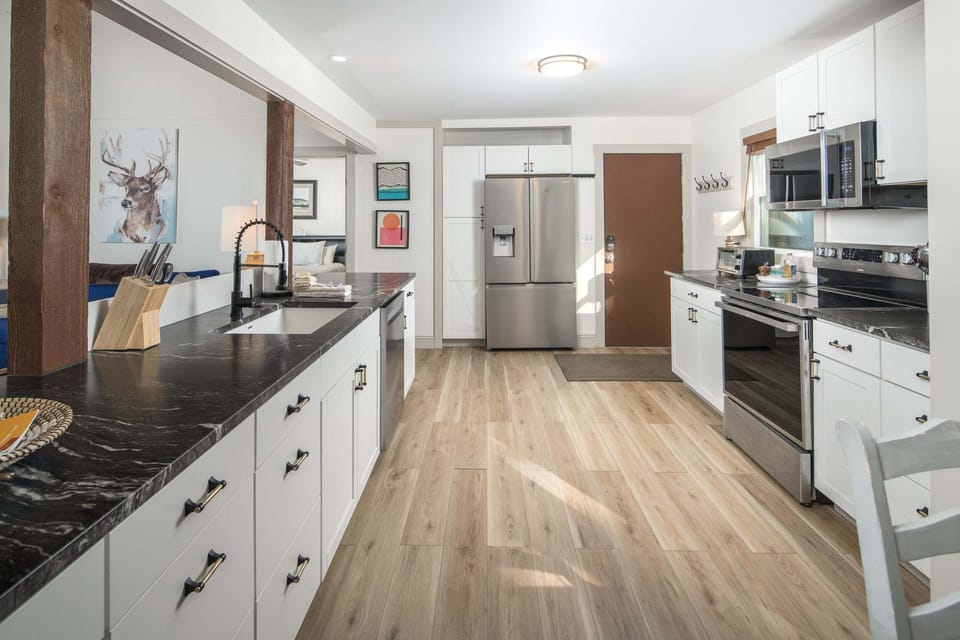 Spacious kitchen with granite countertops and plenty of prep space