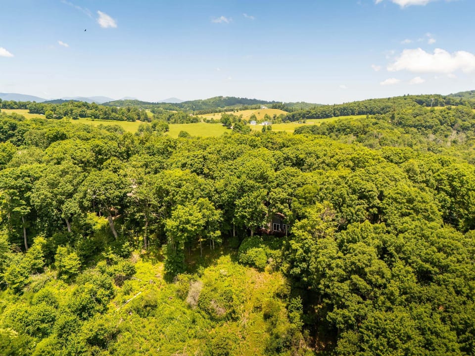 Aerial view showcasing the beautiful mountain setting surrounding the chalet