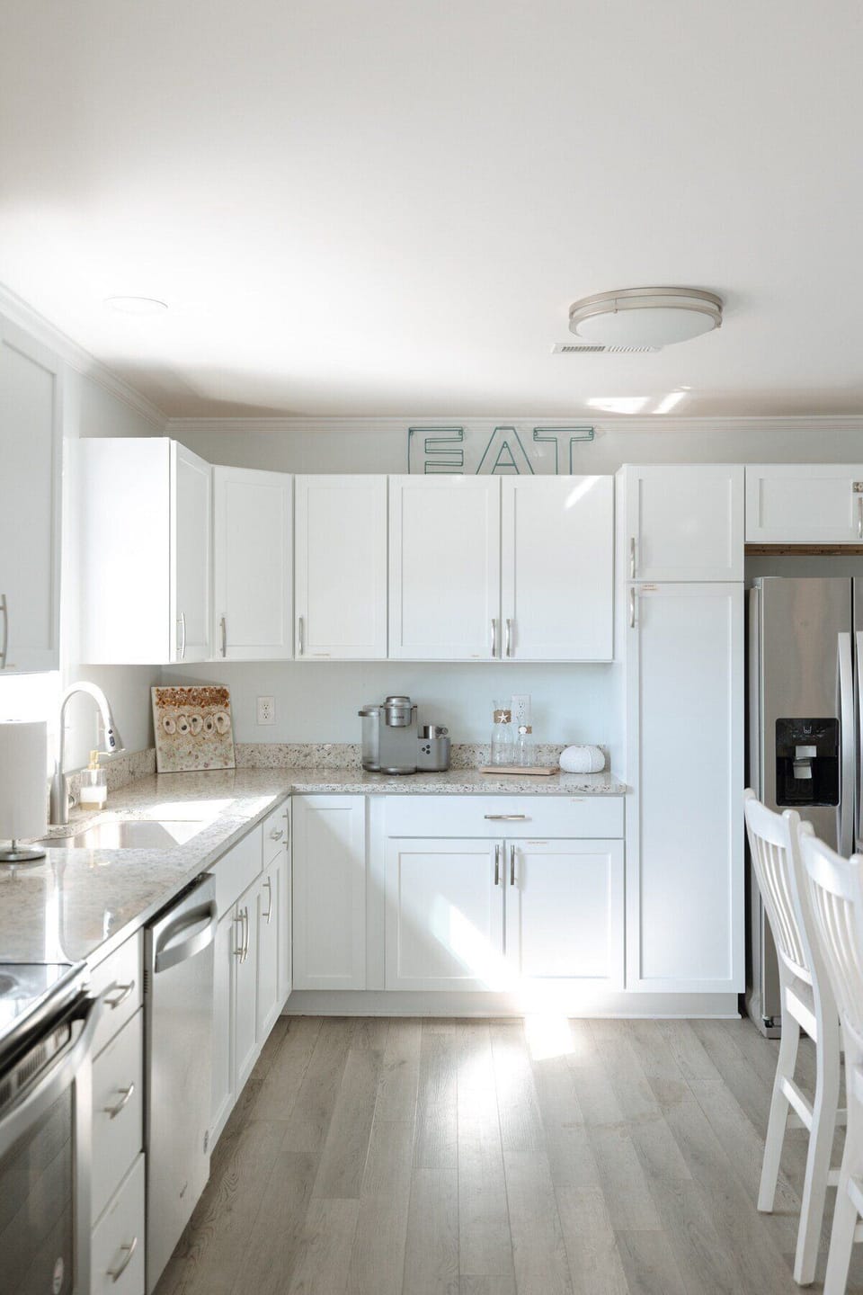 Cook with ease in a fully stocked kitchen complete with modern appliances, cookware, dishes, and everything needed for morning coffee or sunset dinners.