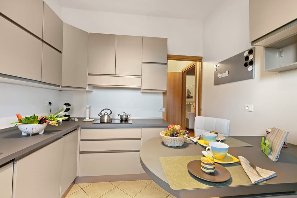 Family Apartment, Multiple Bedrooms (Alelù Classy And Chic Stresa Center) | Private kitchen | Fridge, microwave, oven, stovetop