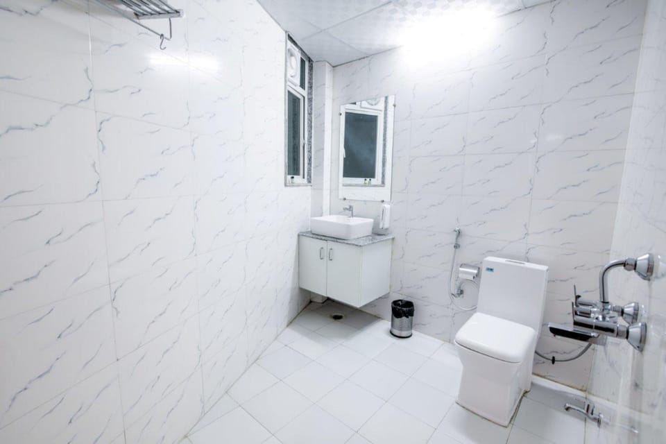 Shower, designer toiletries, hair dryer, slippers