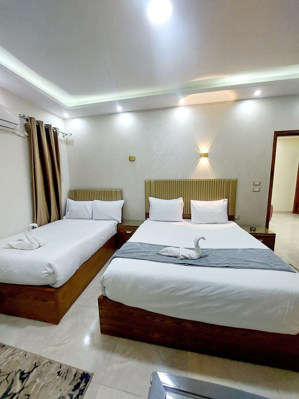 Family Triple Room | Egyptian cotton sheets, premium bedding, in-room safe, blackout drapes
