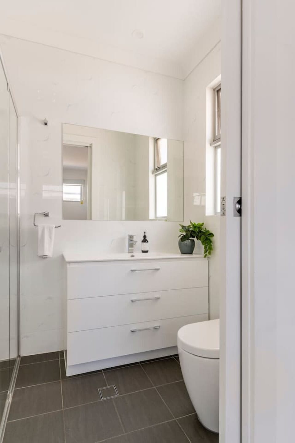 Fresh white bathroom with shower