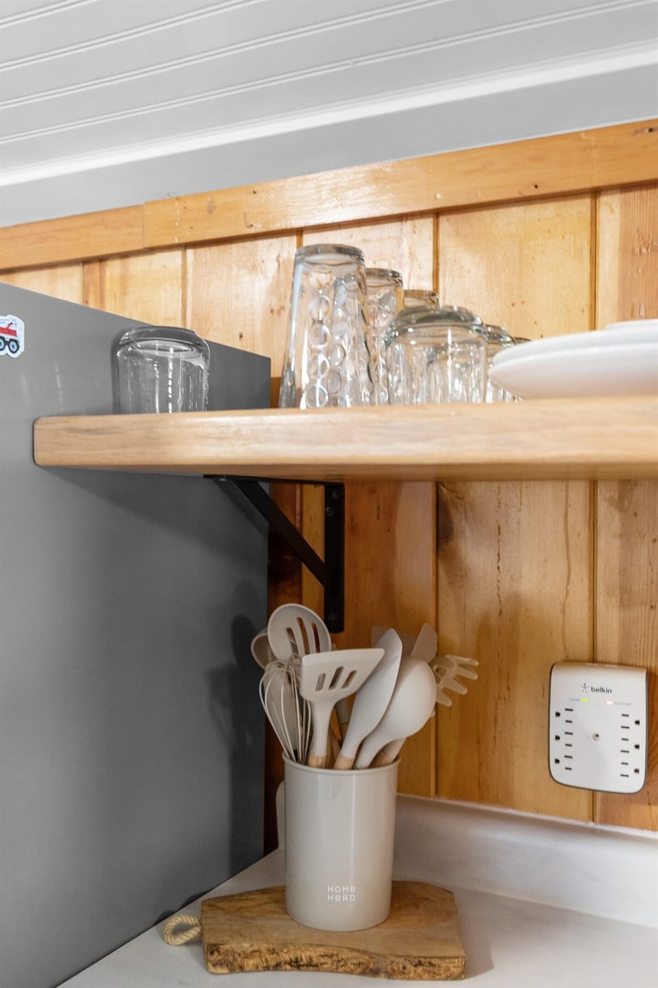 The kitchen is fully stocked with plenty of utensils and essentials, making cooking and meal prep easy and convenient