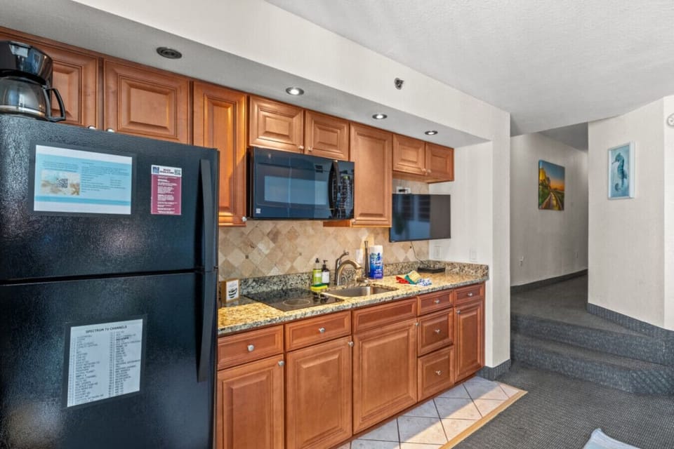 Fully stocked kitchen gives you cookware, modern appliances, dinnerware, silverware, and a Smart TV for entertainment.  Enjoy creating a culinary masterpiece in this oceanfront kitchen while enjoying your vacation,  Has Drip and Keurig Coffee Makers.