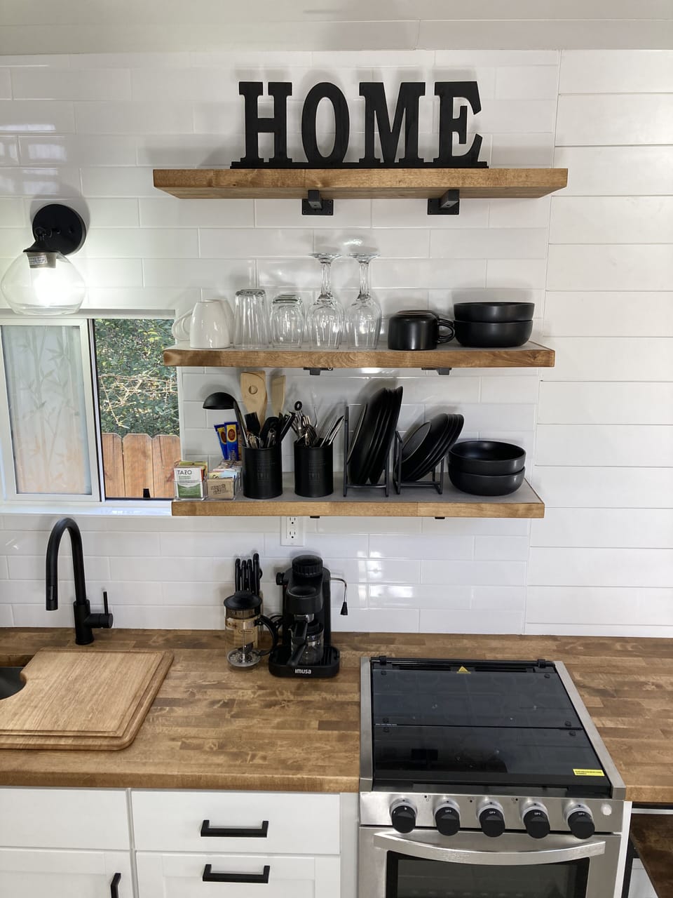 Fully stocked kitchen with gas stove and oven, microwave and small appliances. 