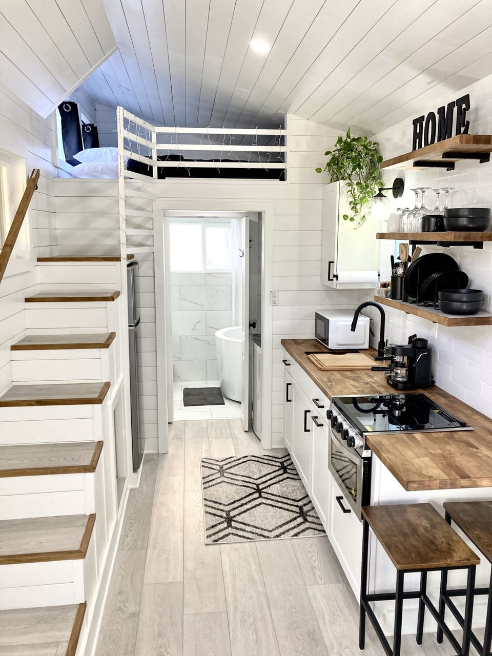 Fully stock Kitchen and stairs to Loft with Queen size bed