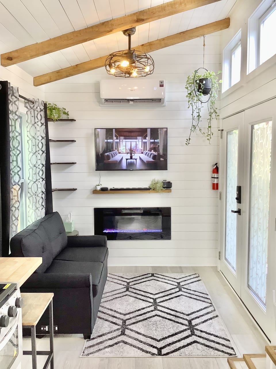 Living room with Full size sleeper sofa, fireplace and streaming TV