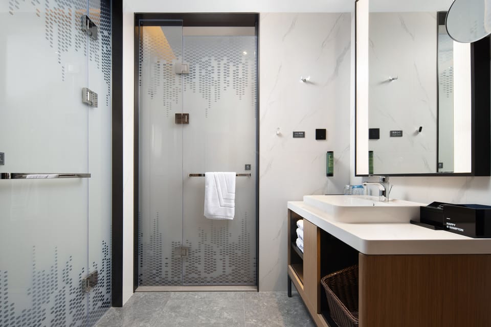 Designer toiletries, hair dryer, bathrobes, slippers