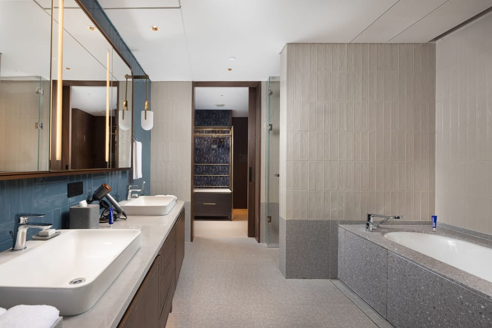 Executive Suite | Bathroom | Designer toiletries, hair dryer, bathrobes, slippers