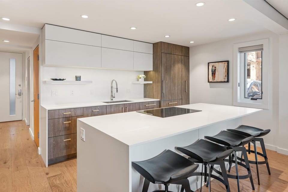 New kitchen with built in appliances and custom cabinetry