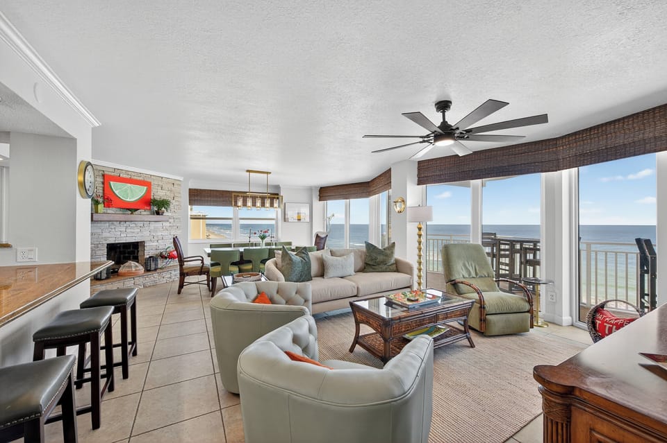 This spacious, open concept living room area has incredible views from every angle