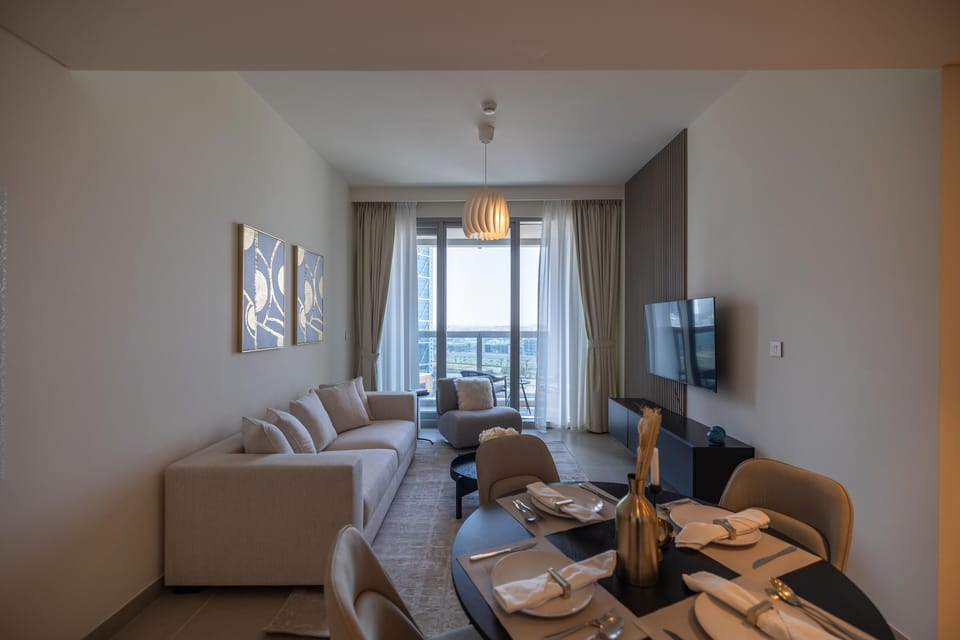 Deluxe Apartment | Living area | 55-inch Smart TV with cable channels