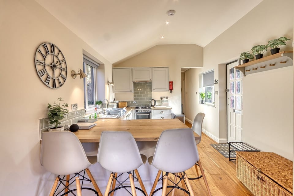 Fully fitted kitchen with large breakfast bar to dine at