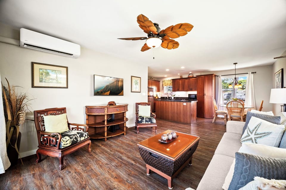 Afternoons land easy here, the ceiling fan turning and water just past the glass.