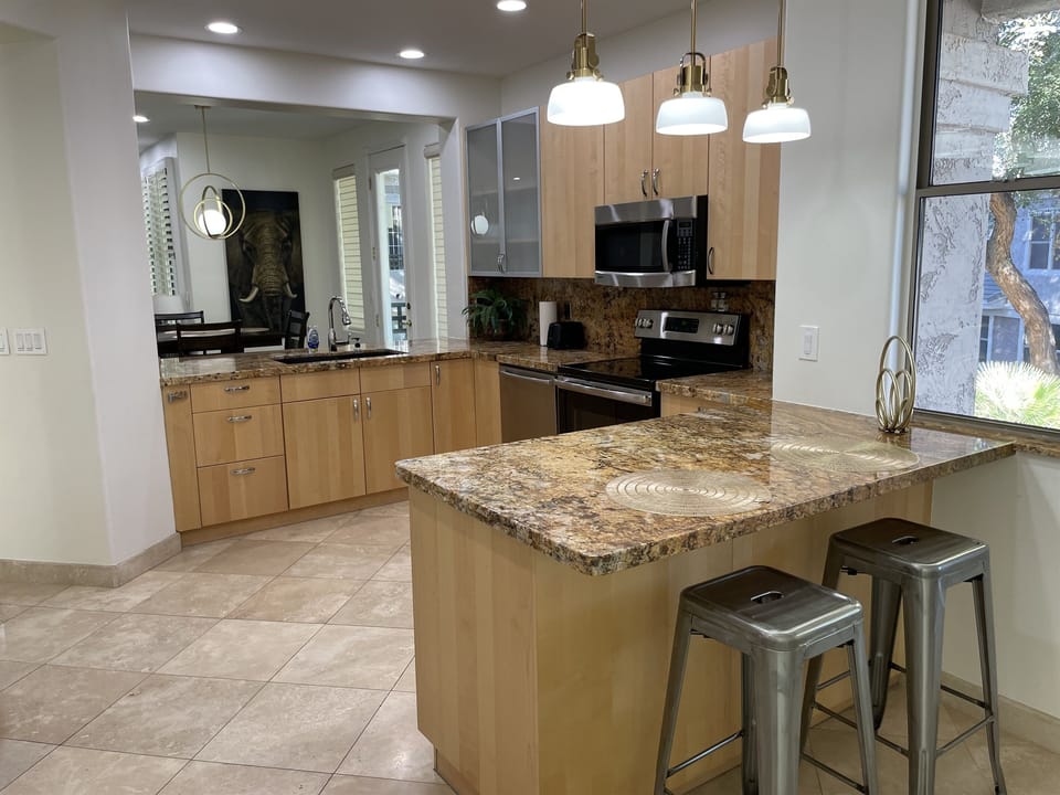 Kitchen overlooks the dining and living rooms and also has beautiful views of the courtyard below.