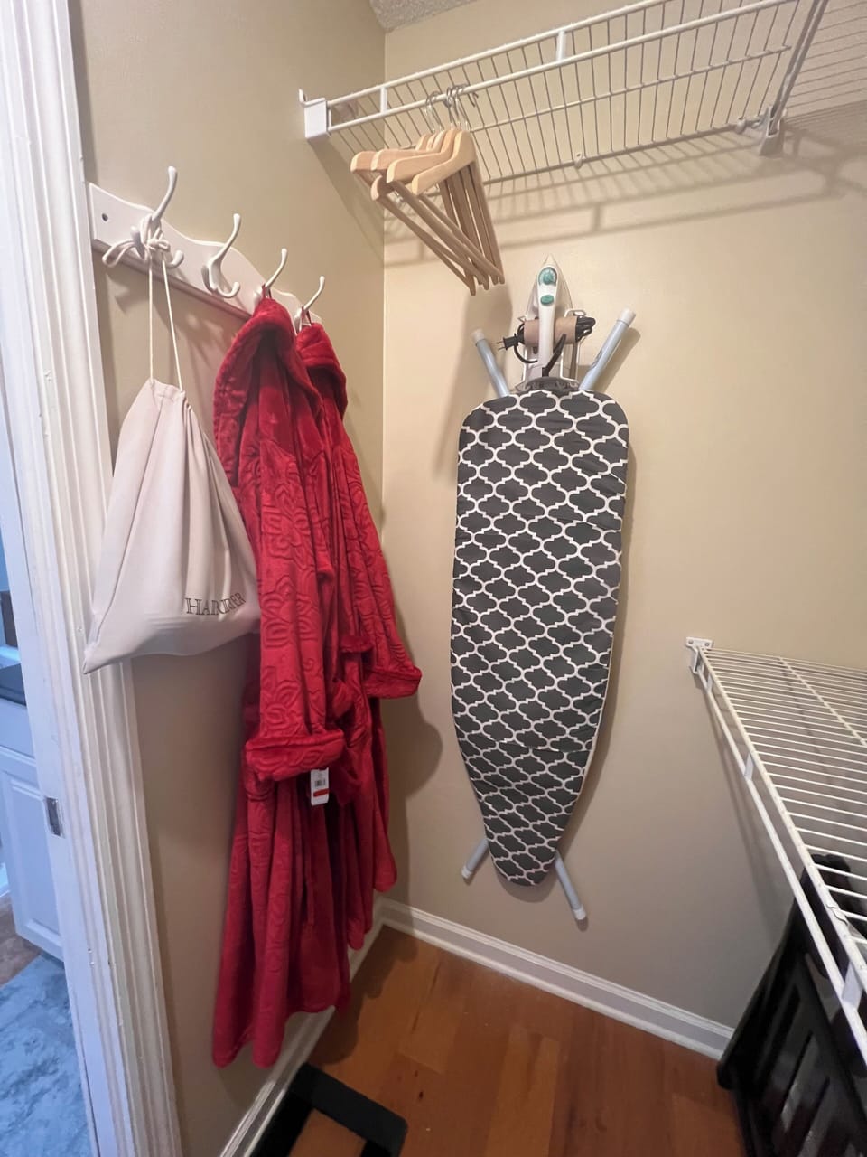 Master closet with complimentary robes, hair dryer, luggage rack and ironing 