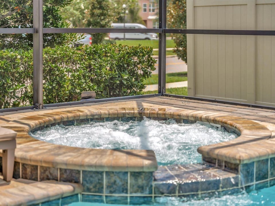 Private screened pool with kids' toys, heated at no extra cost.