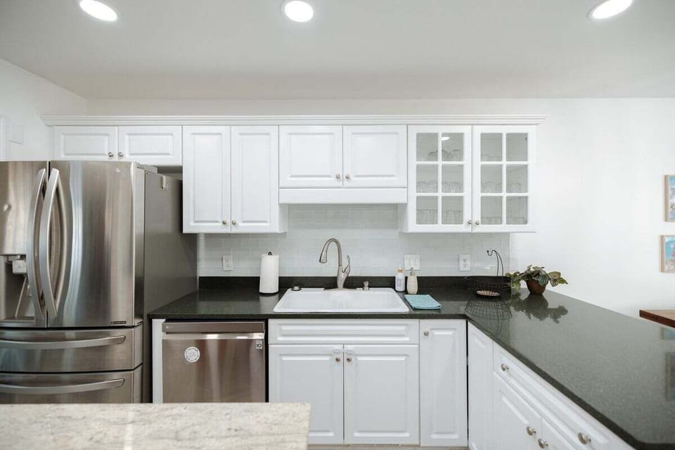Spacious kitchen with full appliances, cookware, spices, and essentials.