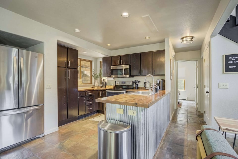 Whip up your favorites in the fully equipped kitchen, complete with stainless steel appliances, spacious countertops, and all the essentials.

