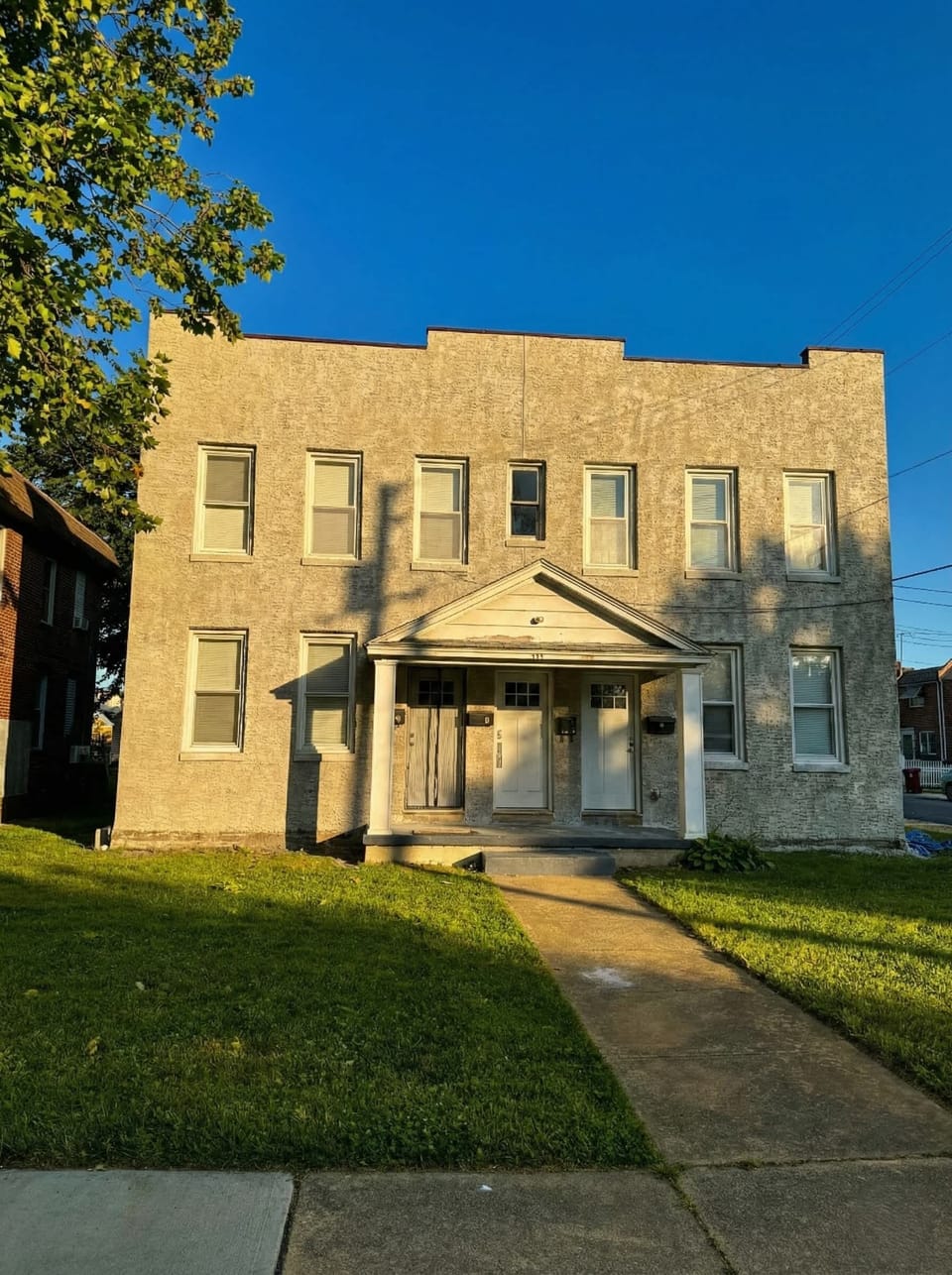 Exterior view of the building entrance and front walkway.