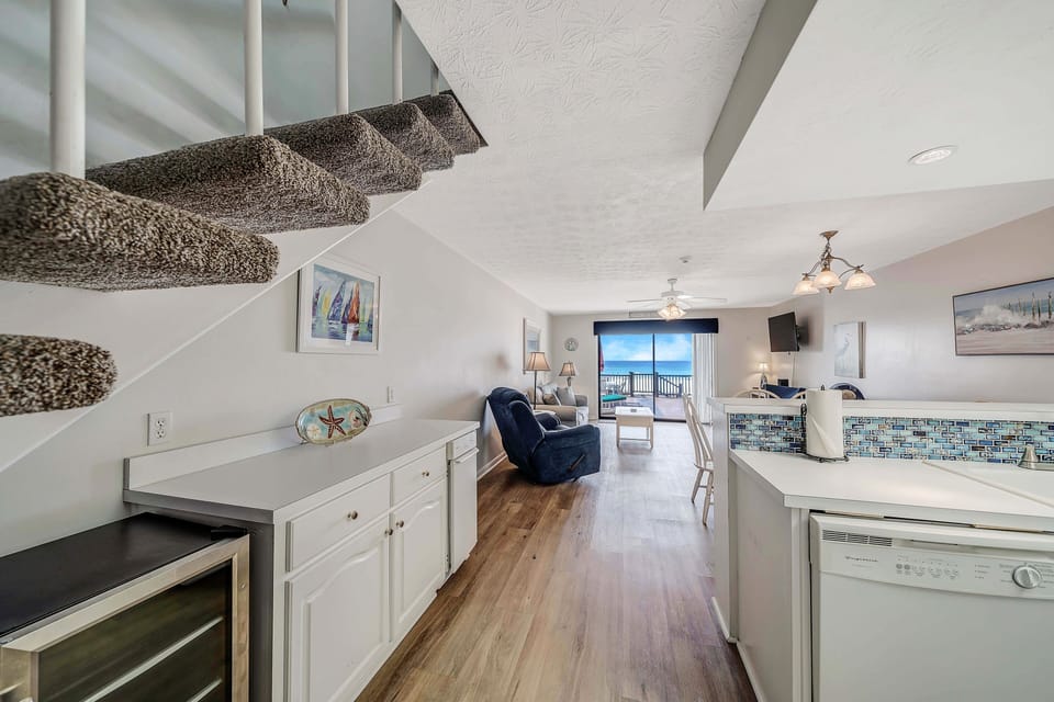 There is a separate wet bar area with beverage cooler and ice maker.
