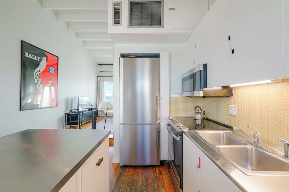 KITCHEN VIEW, LARGE FRIDGE, MOUNTED MICROWAVE