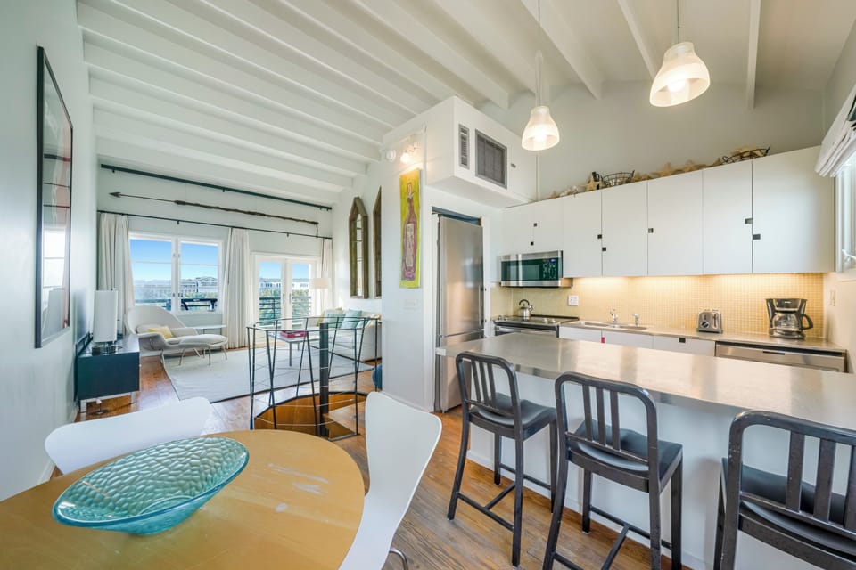 DINING AREA FOR TWO & BAR SEATING FOR 3 AT KITCHEN