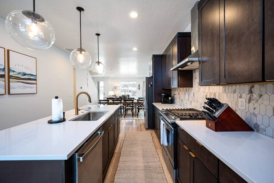 The open concept design allows you to enjoy the stunning mountain views from the kitchen!