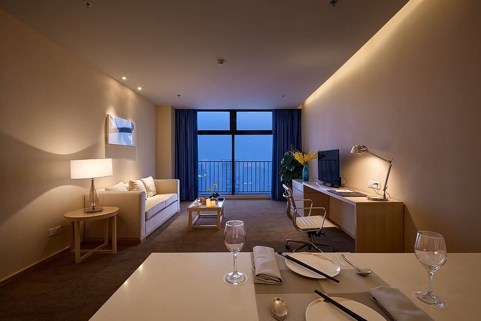 Executive Studio Suite | Living area | TV