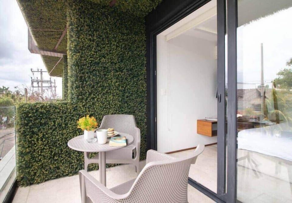 Step onto your private balcony, the perfect spot for morning coffee or evening drinks.