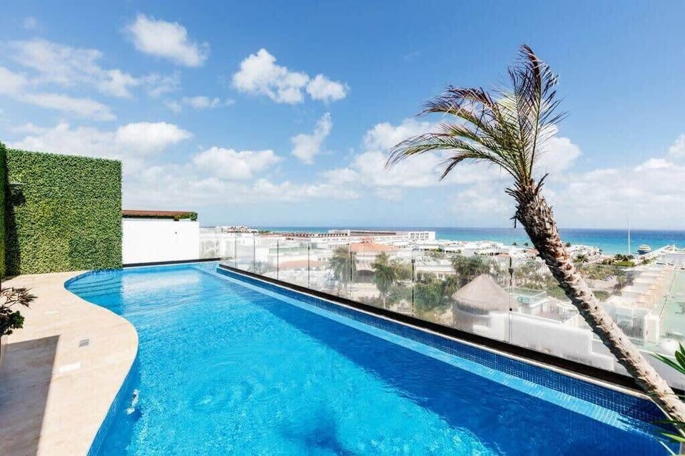 Lounge poolside with uninterrupted views of the Caribbean sky.