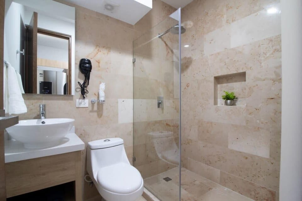 The full bathroom has modern features, drawer space for your things, and a stand-in shower