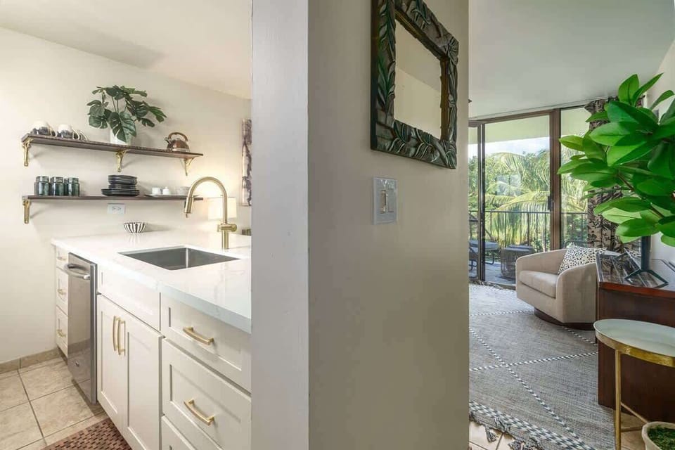 Bright kitchen leads to fresh air & lush views. Everything you need for a relaxing, easy stay!