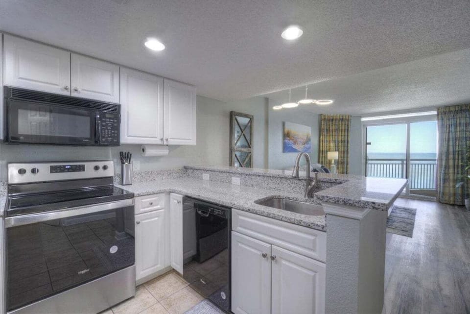 Large Kitchen Area with Granite Countertops