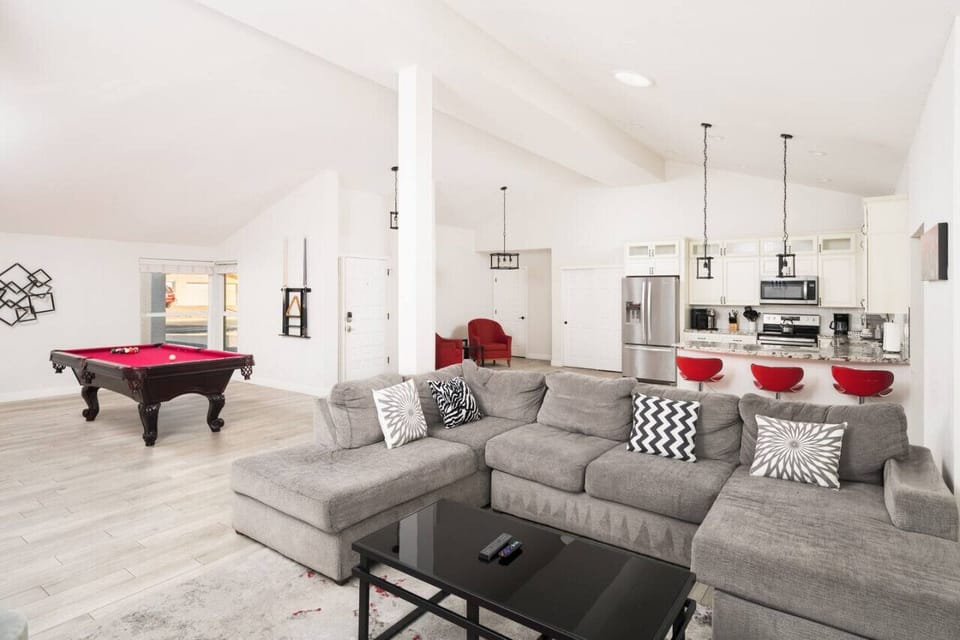 Gather with your group in this spacious living area featuring multiple cozy seating options.