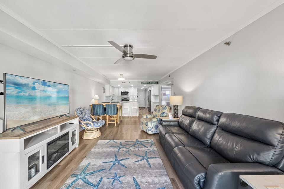 Plenty of seating for the whole family to kick back and watch a movie on the flat screen after a long day on the beach.