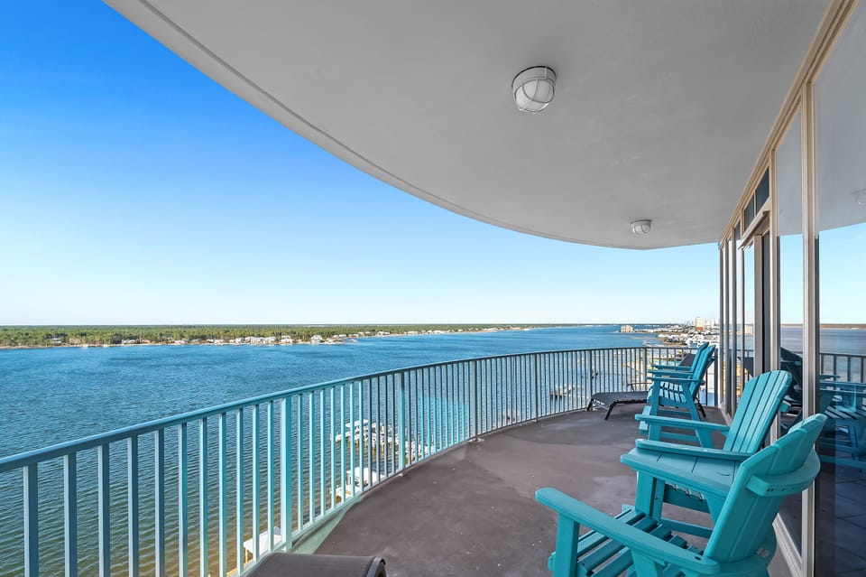 Enjoy 180-degree water views on large balcony overlooking the lagoon and Gulf.