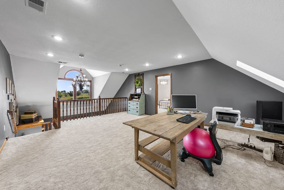Loft overlooks the rolling horse pasture across the street