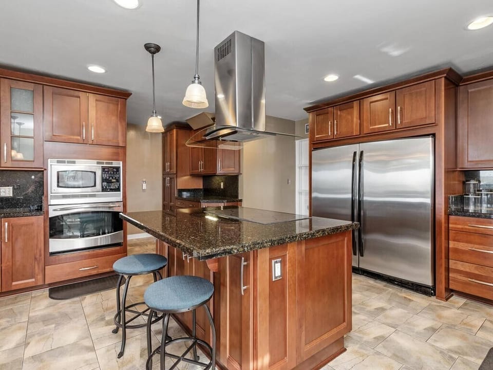 Wooden cabinetry with stainless steel appliances
