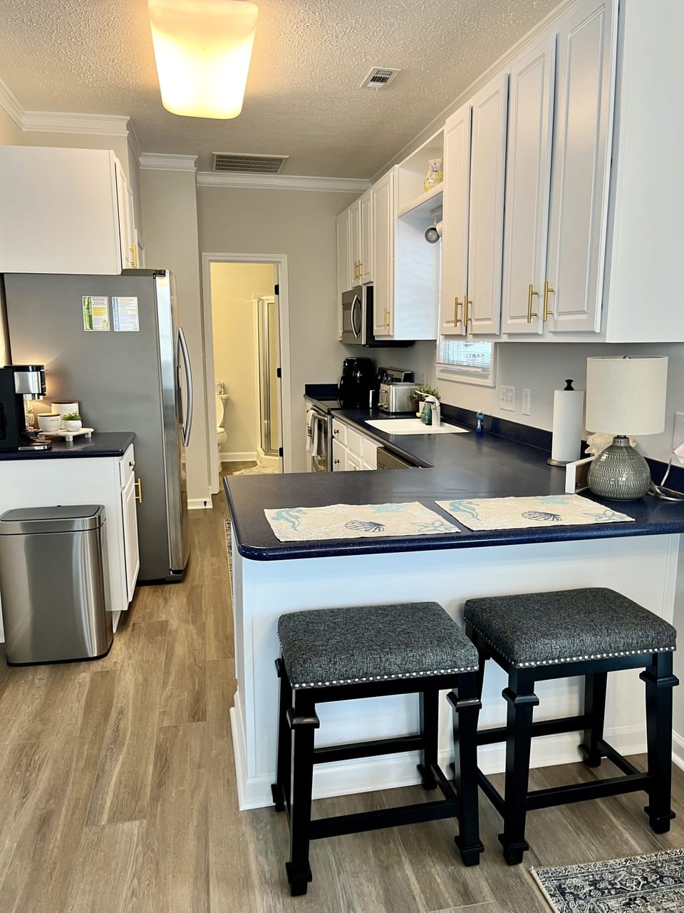 Kitchen view with seating for two at bar