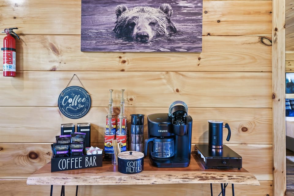 Main floor: Enjoy a cup of coffee from HighPoint Retreat convenient coffee bar: Ground coffee, Ground decaf, K-cup, grinder, Frother, Tea, Sweeteners and variety of flavoring syrups