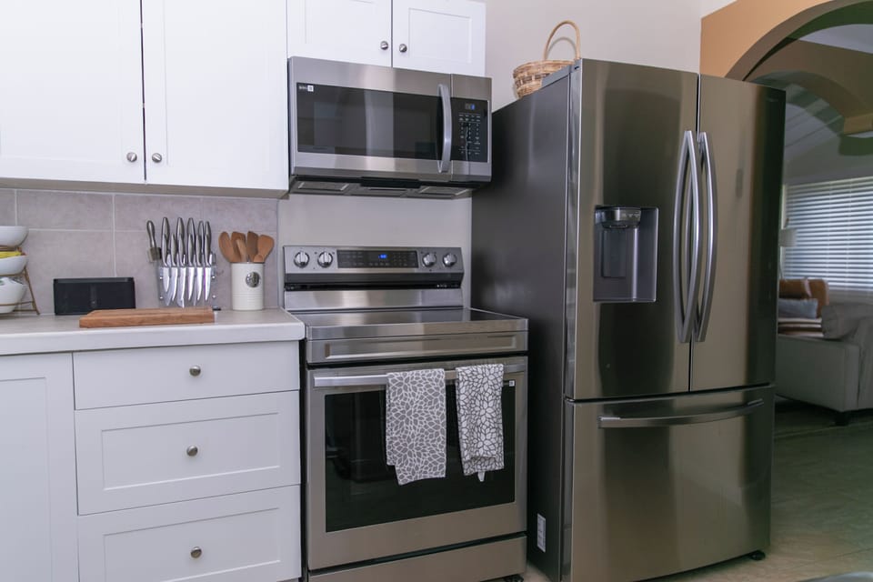 Fully equipped kitchen with modern appliances and everything needed for meals. 