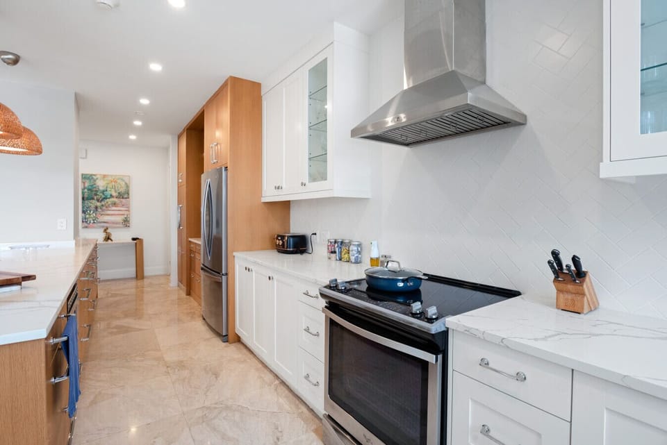 Sleek, fully stocked kitchen with large prep-and-serve island.